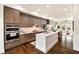 Modern kitchen features stainless steel appliances, white countertops, and a central island, perfect for culinary enthusiasts at 6657 Encore Blvd, Atlanta, GA 30328
