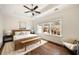 Main bedroom featuring lots of natural light, and refined contemporary decor overlooking neighborhood at 6657 Encore Blvd, Atlanta, GA 30328