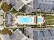 Aerial view of a luxurious community pool with ample lounge chairs and manicured landscaping at 6657 Encore Blvd, Atlanta, GA 30328