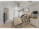 Nicely appointed bedroom with neutral tones, carpeted floors, and a ceiling fan at 154 Hunters Trl, Dallas, GA 30157