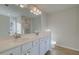 Main bathroom with double sink vanity, tile floors, and glass shower at 325 Heavenly Hollow Pl, Mcdonough, GA 30253