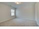 Bedroom with carpet flooring, a window and neutral paint at 325 Heavenly Hollow Pl, Mcdonough, GA 30253