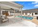 Backyard pool with a white wooden deck and an overhead fan, surrounded by lush landscaping at 4087 Glenn Rd, Powder Springs, GA 30127