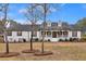 Charming ranch-style home with a welcoming front porch and dormer windows at 4087 Glenn Rd, Powder Springs, GA 30127