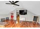 Upstairs living room features hardwood floors, a ceiling fan, and a door to an exercise room at 4087 Glenn Rd, Powder Springs, GA 30127