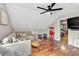 Upstairs living room features hardwood floors, a ceiling fan, and a door to an exercise room at 4087 Glenn Rd, Powder Springs, GA 30127