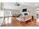 Bright living room with a fireplace and French doors leading to the outside at 4087 Glenn Rd, Powder Springs, GA 30127