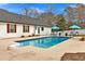 Backyard pool with poolside seating and views of the home's exterior at 4087 Glenn Rd, Powder Springs, GA 30127