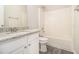 Bright bathroom featuring a granite countertop vanity and a shower over tub at 503 Goldfinch Way, Stockbridge, GA 30281