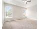 A spacious bedroom featuring a ceiling fan and two windows offering natural light at 503 Goldfinch Way, Stockbridge, GA 30281