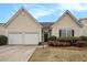 Charming home featuring a two-car garage, manicured lawn, and inviting entrance at 503 Goldfinch Way, Stockbridge, GA 30281