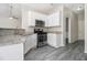 Modern kitchen featuring stainless steel appliances, granite counters, and ample cabinet space at 503 Goldfinch Way, Stockbridge, GA 30281