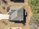 Aerial view of the home showing the roof and surrounding landscaping at 6068 Magnolia Rdg, Stone Mountain, GA 30087