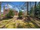 Expansive backyard with a mix of trees and lawn at 6068 Magnolia Rdg, Stone Mountain, GA 30087