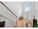 Stunning foyer featuring hardwood floors, natural light, and elegant staircase at 6068 Magnolia Rdg, Stone Mountain, GA 30087