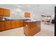 Well-lit kitchen with island and views to the eating area and outside at 6068 Magnolia Rdg, Stone Mountain, GA 30087