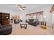 Spacious living room featuring a ceiling fan and large windows at 6068 Magnolia Rdg, Stone Mountain, GA 30087