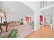 Spacious living room featuring neutral carpet, white walls, and hardwood hallway at 6068 Magnolia Rdg, Stone Mountain, GA 30087