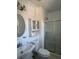 Bathroom featuring white cabinets, a toilet, and a glass-enclosed shower at 866 Indian Lake Nw Dr, Lilburn, GA 30047