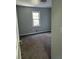 Bedroom featuring neutral walls, a window, and gray carpet at 866 Indian Lake Nw Dr, Lilburn, GA 30047