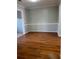 Dining room with neutral paint and hardwood floors at 866 Indian Lake Nw Dr, Lilburn, GA 30047