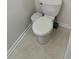 Close-up on a standard toilet with linoleum flooring at 866 Indian Lake Nw Dr, Lilburn, GA 30047