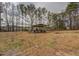 Large backyard with covered shelter and mature trees at 2375 Gum Creek Rd, Oxford, GA 30054