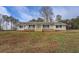 Ranch style home with white siding, inviting front porch, and well-manicured lawn at 2375 Gum Creek Rd, Oxford, GA 30054