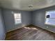 Bedroom with hardwood floors, two windows and blue walls at 2909 Diana Sw Dr, Atlanta, GA 30315