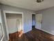 Bedroom featuring hardwood floors, a closet, and a white door at 2909 Diana Sw Dr, Atlanta, GA 30315