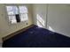 Cozy bedroom with bright natural light and blue carpeting at 2909 Diana Sw Dr, Atlanta, GA 30315