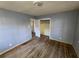 Bedroom showcasing hardwood floors, blue walls and closet at 2909 Diana Sw Dr, Atlanta, GA 30315