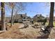 Inviting backyard with a fire pit, comfortable seating, and string lights for outdoor enjoyment at 3825 Bishops Walk, Cumming, GA 30041