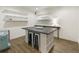 Basement craft room with sleek countertops, an island with seating, and a modern aesthetic at 3825 Bishops Walk, Cumming, GA 30041