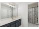 Bathroom featuring a spacious vanity with updated fixtures and a shower with a patterned curtain at 3825 Bishops Walk, Cumming, GA 30041