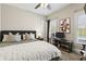 This modern bedroom features a comfortable bed, sleek furniture, and ample natural light at 3825 Bishops Walk, Cumming, GA 30041