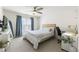 Bright bedroom with a ceiling fan, a comfortable bed, and a functional desk space at 3825 Bishops Walk, Cumming, GA 30041