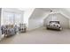 Bonus room with plenty of natural light, seating area, and bed at 3825 Bishops Walk, Cumming, GA 30041