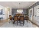 Bright dining room with a patterned wallpaper and glass doors leading to the outdoor space, perfect for entertaining at 3825 Bishops Walk, Cumming, GA 30041