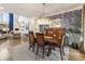 Open-concept dining area featuring hardwood floors, a decorative chandelier, and sophisticated wall decor at 3825 Bishops Walk, Cumming, GA 30041