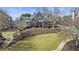 Charming two-story home features a landscaped front yard, brick accents, and a welcoming entrance at 3825 Bishops Walk, Cumming, GA 30041