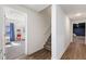 Hallway leading to finished basement with ample space and a view of the entertainment room at 3825 Bishops Walk, Cumming, GA 30041