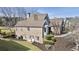Lovely brick home boasts mature landscaping, green grass, and a backyard with room to entertain at 3825 Bishops Walk, Cumming, GA 30041