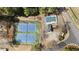 Aerial view of the community tennis courts, pool, and sunbathing deck at 3825 Bishops Walk, Cumming, GA 30041