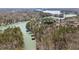 The scenic view shows the community waterfront, lush trees, and tranquil water at 3825 Bishops Walk, Cumming, GA 30041