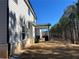 The house with a view of the backyard area highlighting the natural surroundings and trees at 4161 Dean Grove Way, Loganville, GA 30052