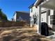 Spacious backyard with privacy fence and neighboring house at 4161 Dean Grove Way, Loganville, GA 30052