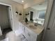 Bright bathroom showcasing double vanity, large mirror, and modern fixtures at 4161 Dean Grove Way, Loganville, GA 30052