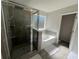 Modern bathroom featuring a glass-enclosed shower, soaking tub, and neutral tones at 4161 Dean Grove Way, Loganville, GA 30052