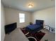 Cozy bedroom featuring plush carpet, a black bed frame, and a modern black TV at 4161 Dean Grove Way, Loganville, GA 30052